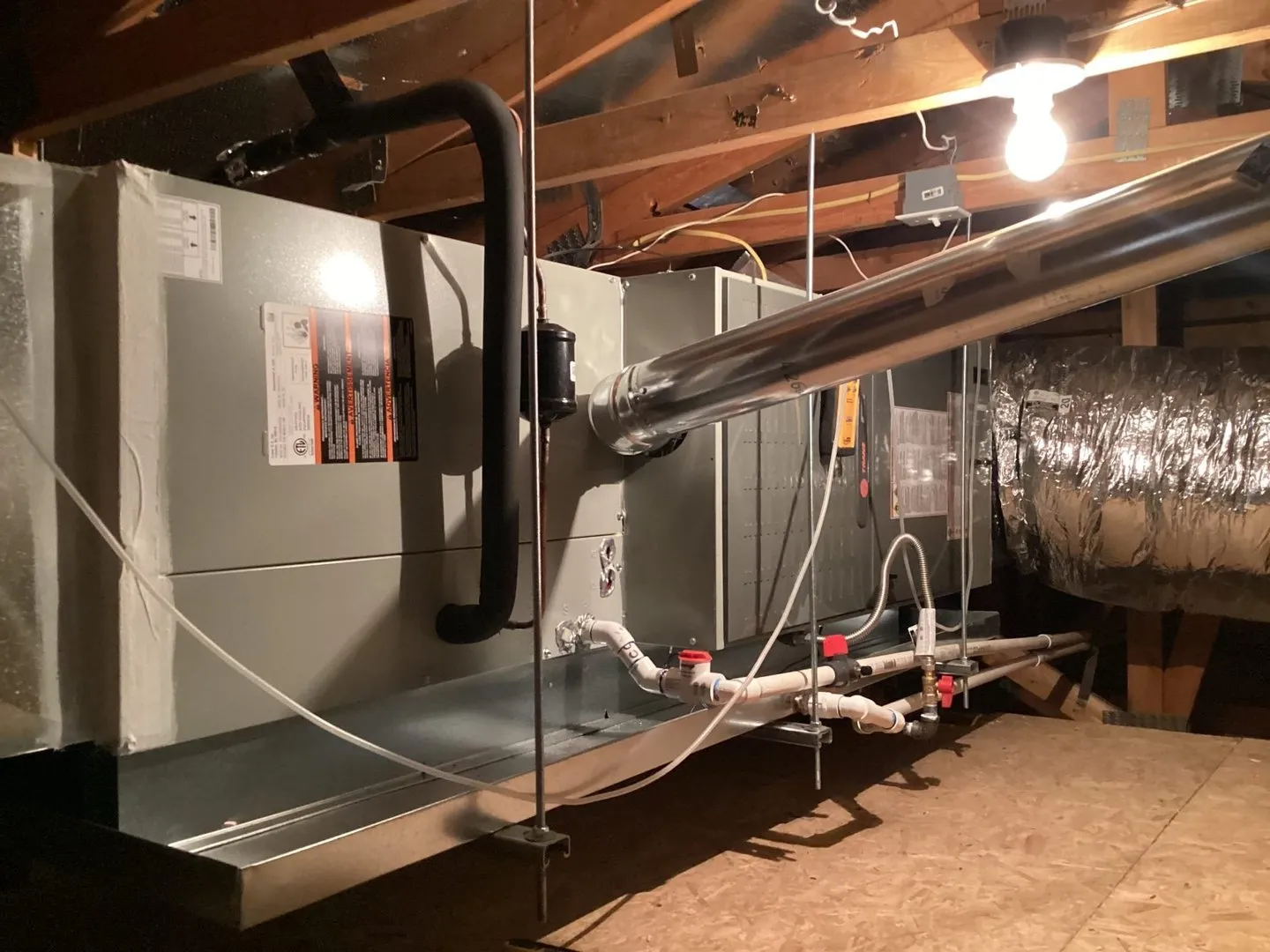 An attic air handler with insulated ductwork and a new supply plenum